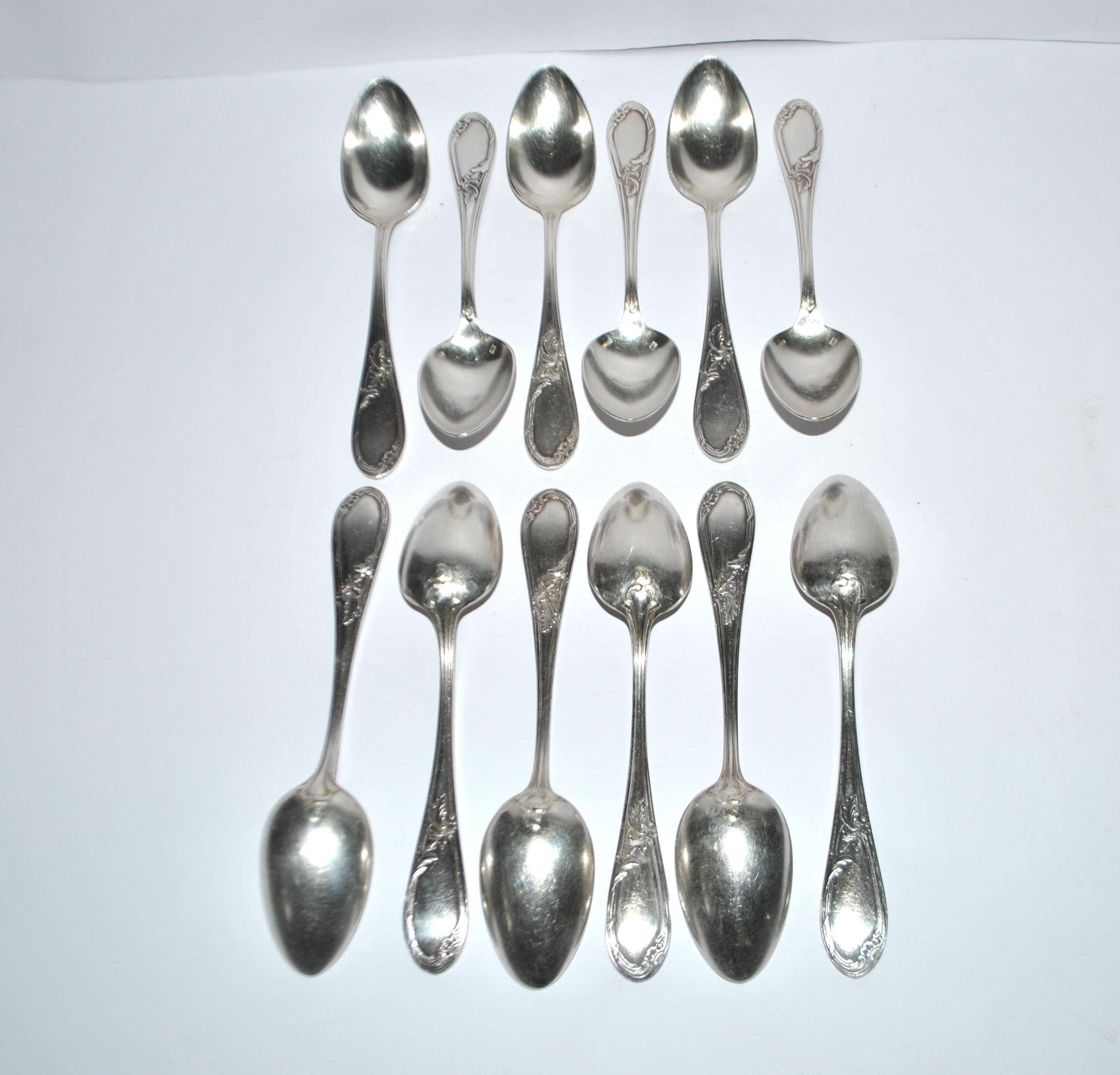 Lot of 12 silver-plated dessert spoons apollo rocaille model.
