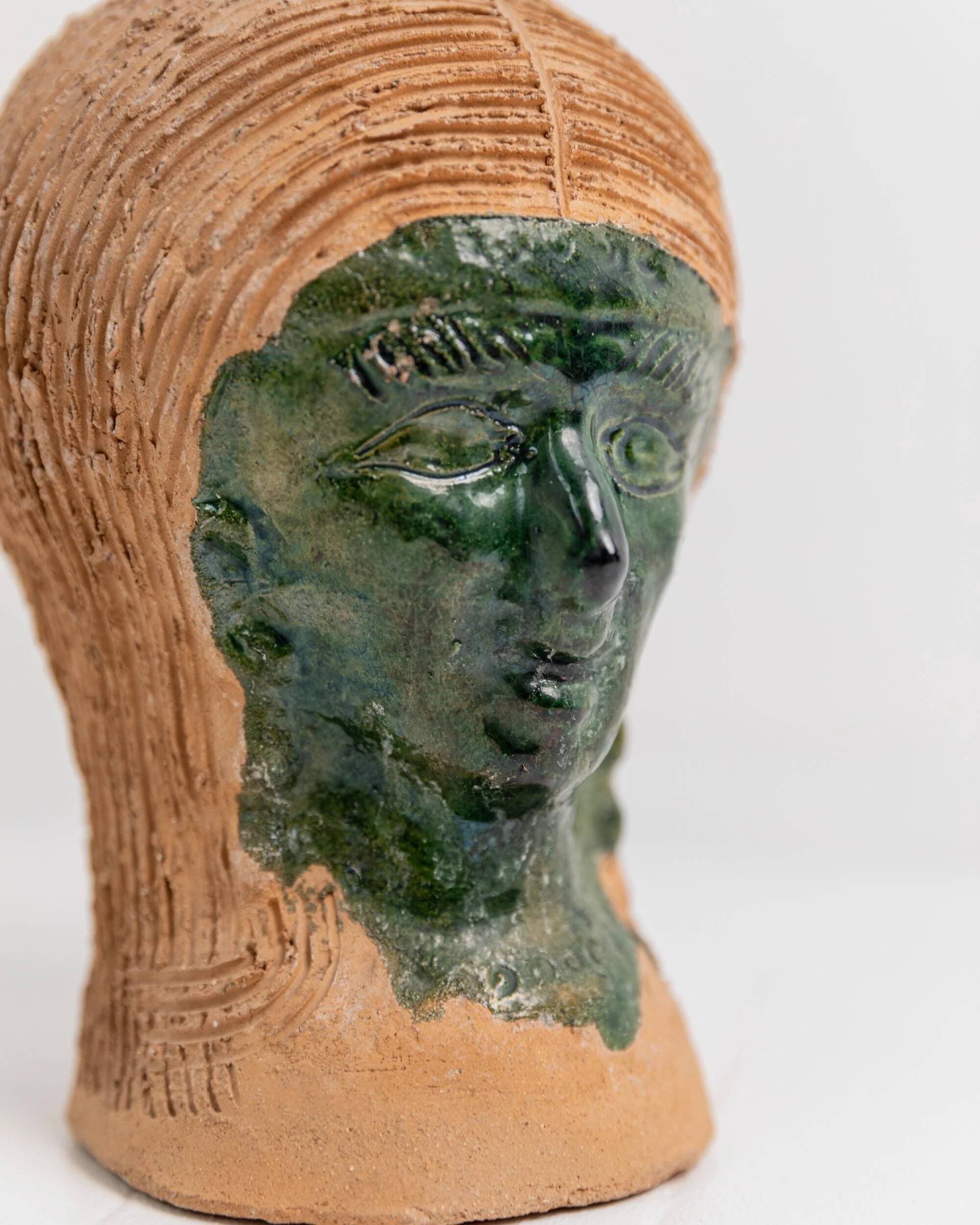 Vintage ceramic vase from the 1980s, sculptural head shape with a green glazed face, terracotta art object.