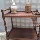 Dessert, table with wheels, side table in solid wood stained brown color France 1960