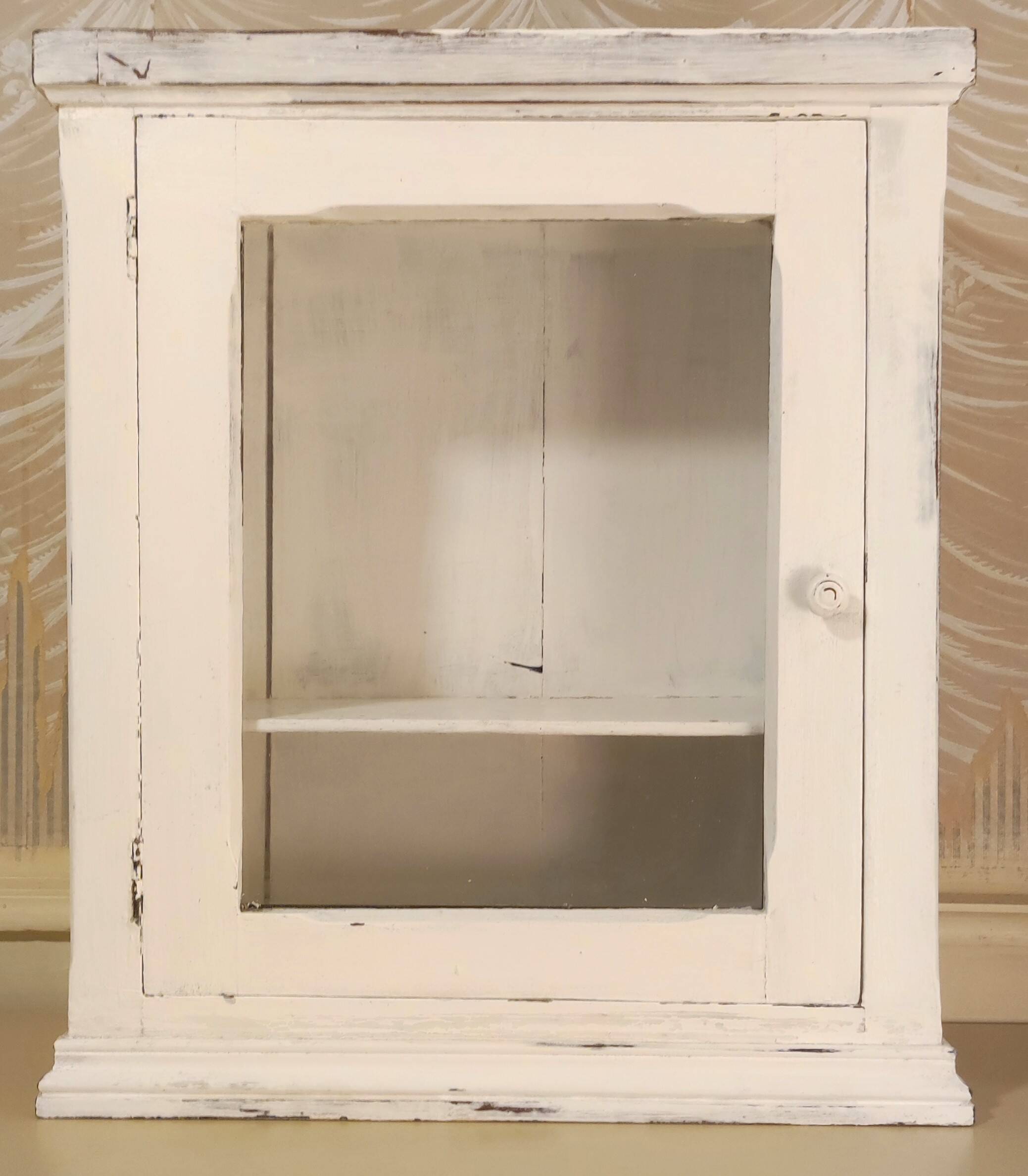 Glazed wall-mounted medicine cabinet in patinated wood