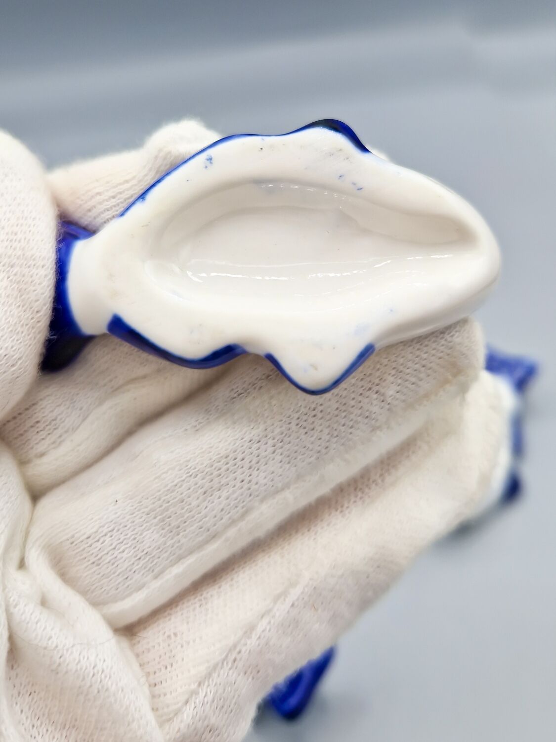 Set of 11 vintage blue and white porcelain fish knife rests.