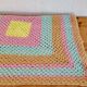 Vintage pastel crochet blanket for children.