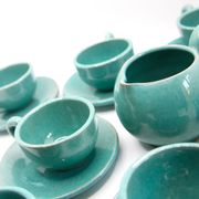 Set of 6 cups in turquoise blue enamelled earth with their saucers and milk jar