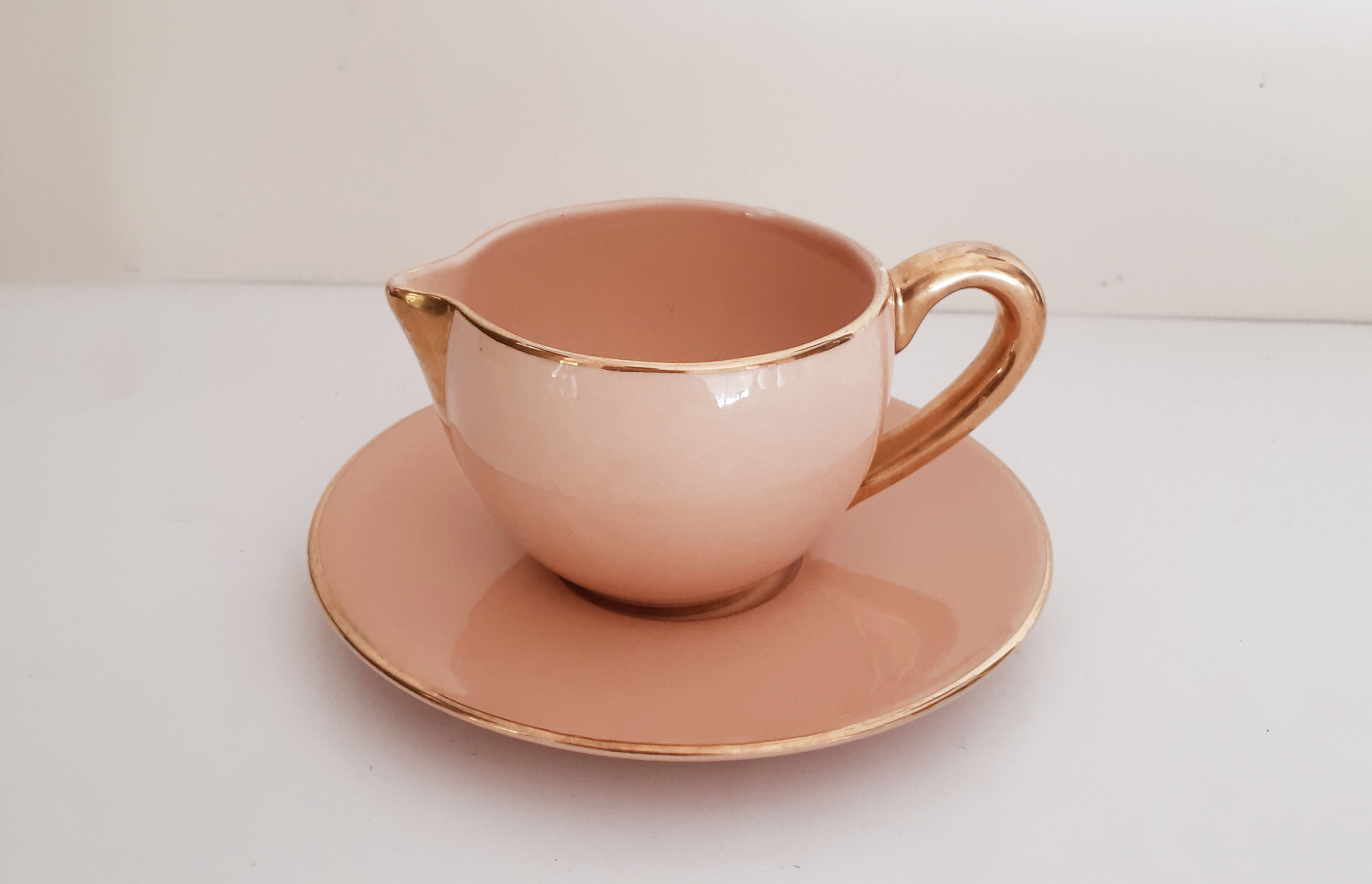 Cup pourer in pink and gold earthenware, vintage
