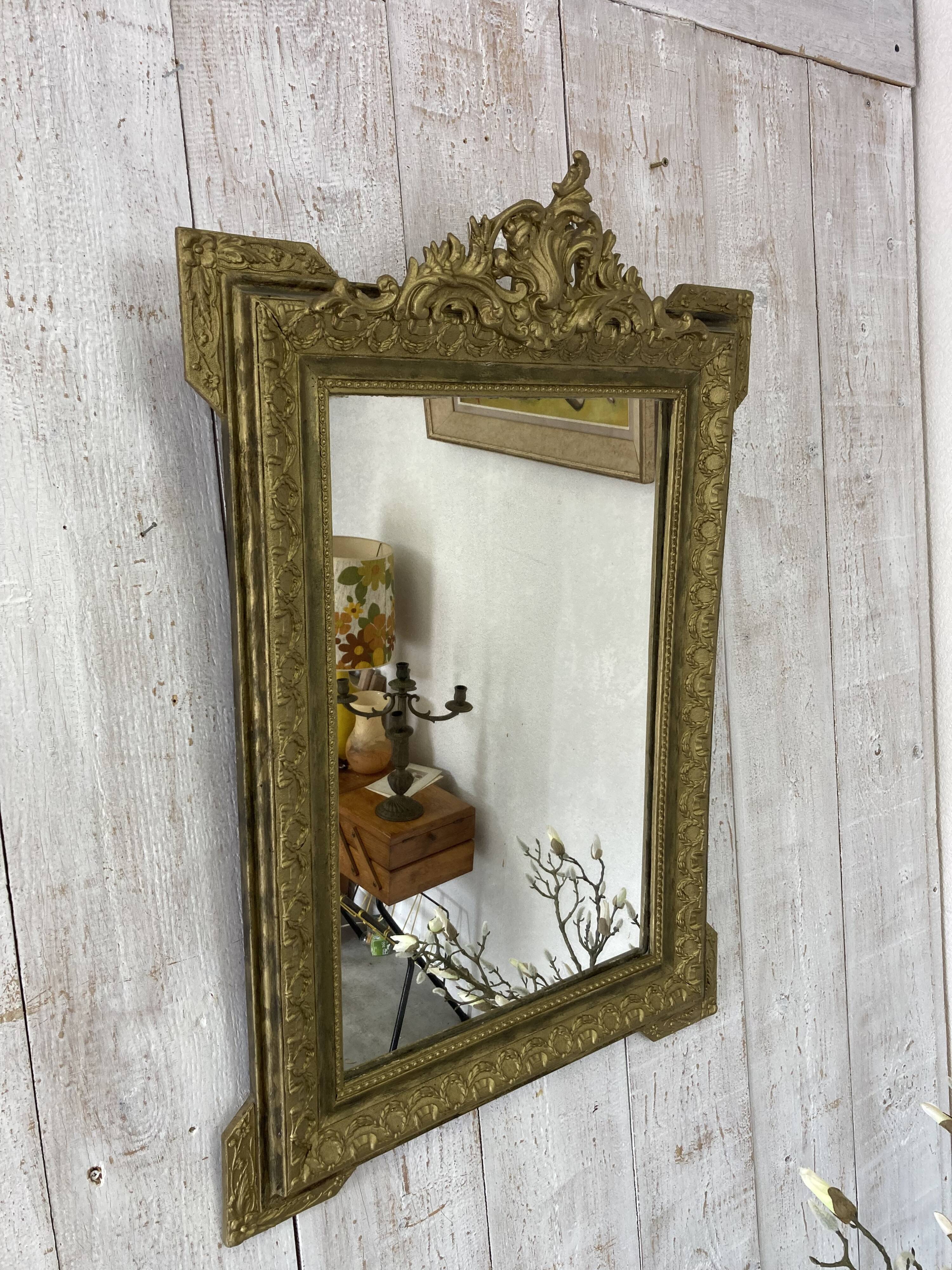 Antique mirror with a pediment