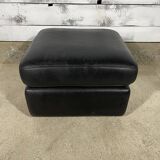 Black leather pouf
