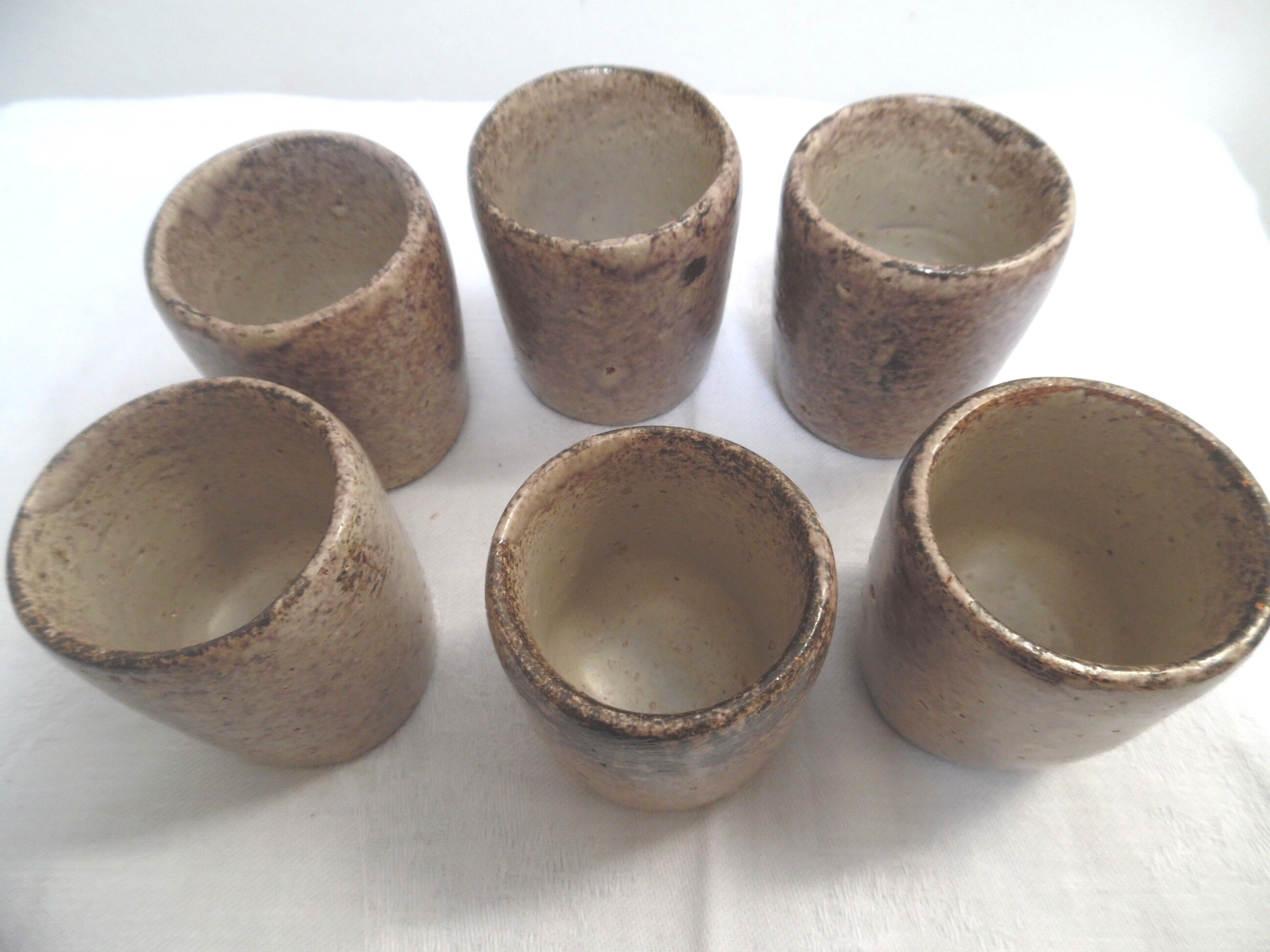 Six cups in stoneware