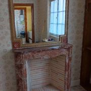 Pompadour fireplace in pink marble