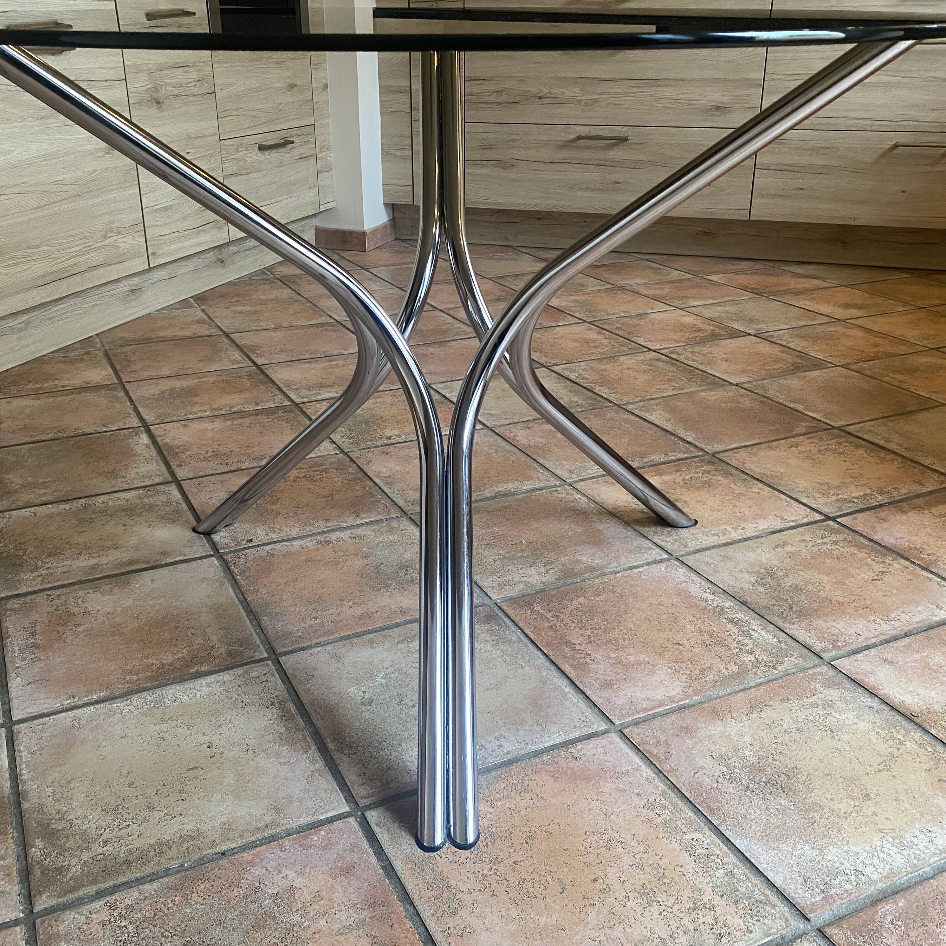 Tripod table Roche Bobois. 1970. Chrome and smoked glass.