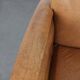 Luxury armchair made of cowhide leather with a beautiful warm colour scheme