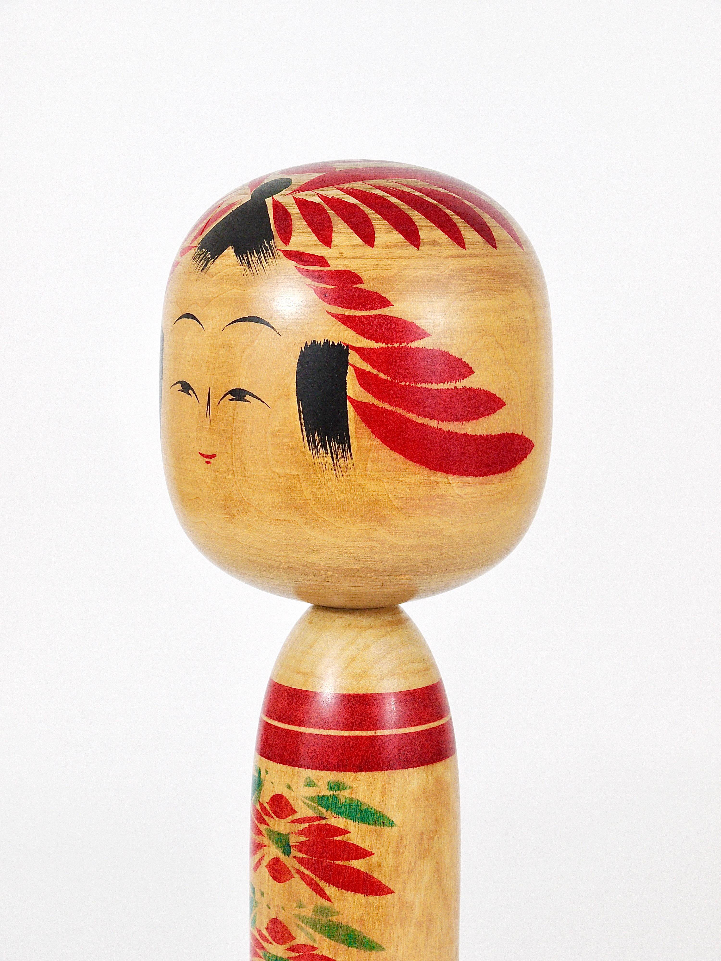 Decorative Togatta Kokeshi doll sculpture from northern Japan, hand-painted.