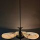 Art Deco bronze three-arm chandelier with marbled glass shades.