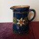 Antique earthenware milk jug