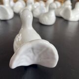 11 zoomorphic ceramic knife rests in white