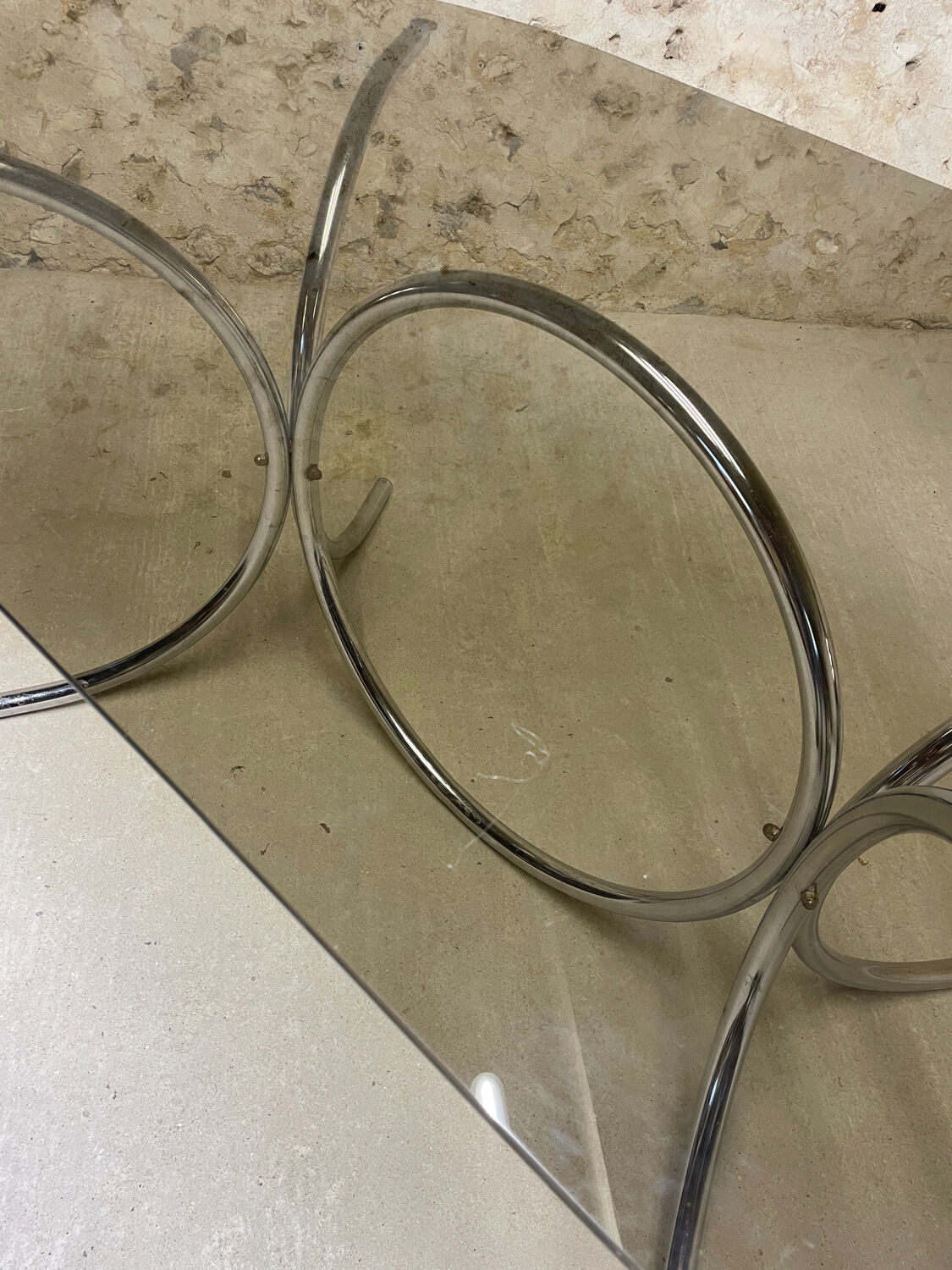 Smoked glass oval table from the 1970s.