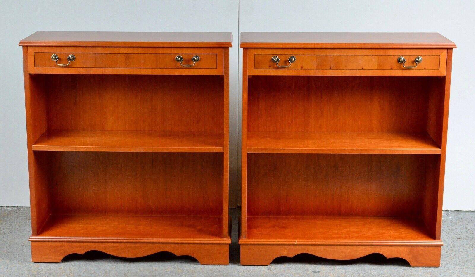 Pair of light walnut bookshelves with inlays and adjustable shelves.
