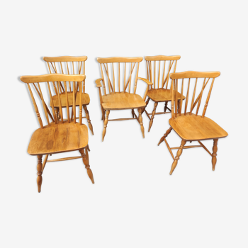 Four chairs and a Heywood Wakefield Windsor armchair. Vintage