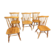 Four chairs and a Heywood Wakefield Windsor armchair. Vintage