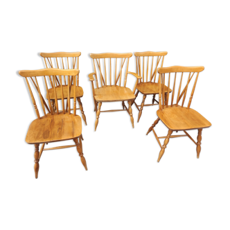 Four chairs and a Heywood Wakefield Windsor armchair. Vintage