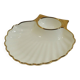 Shell-shaped porcelain pocket bowl from Queen’s Porcelain, with a gold rim.