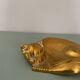 Cat-shaped catchall that looks like it's sleeping.