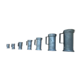 Set of 7 pots of tin measures