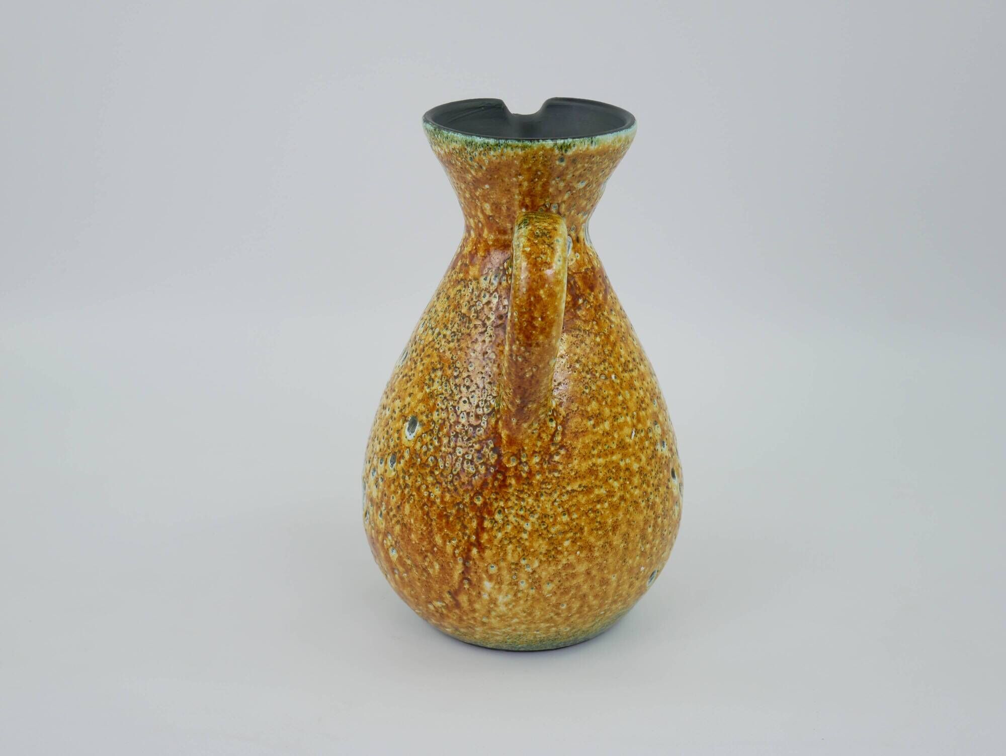 Large yellow ceramic pitcher in the Accolay style