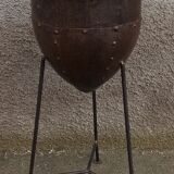 Old metal pot on foot