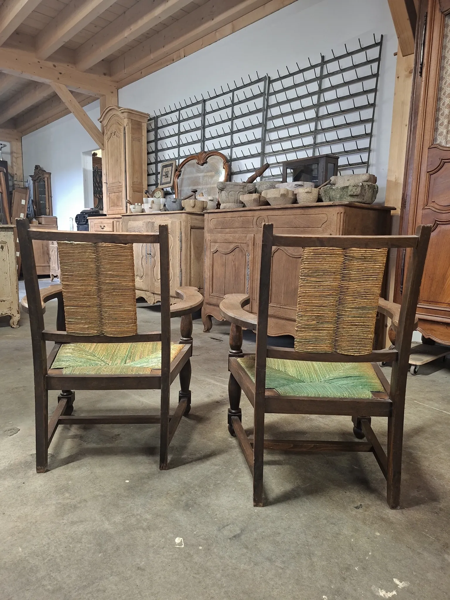 Brutalist pair of rustic turned wooden armchairs from the 1950s.