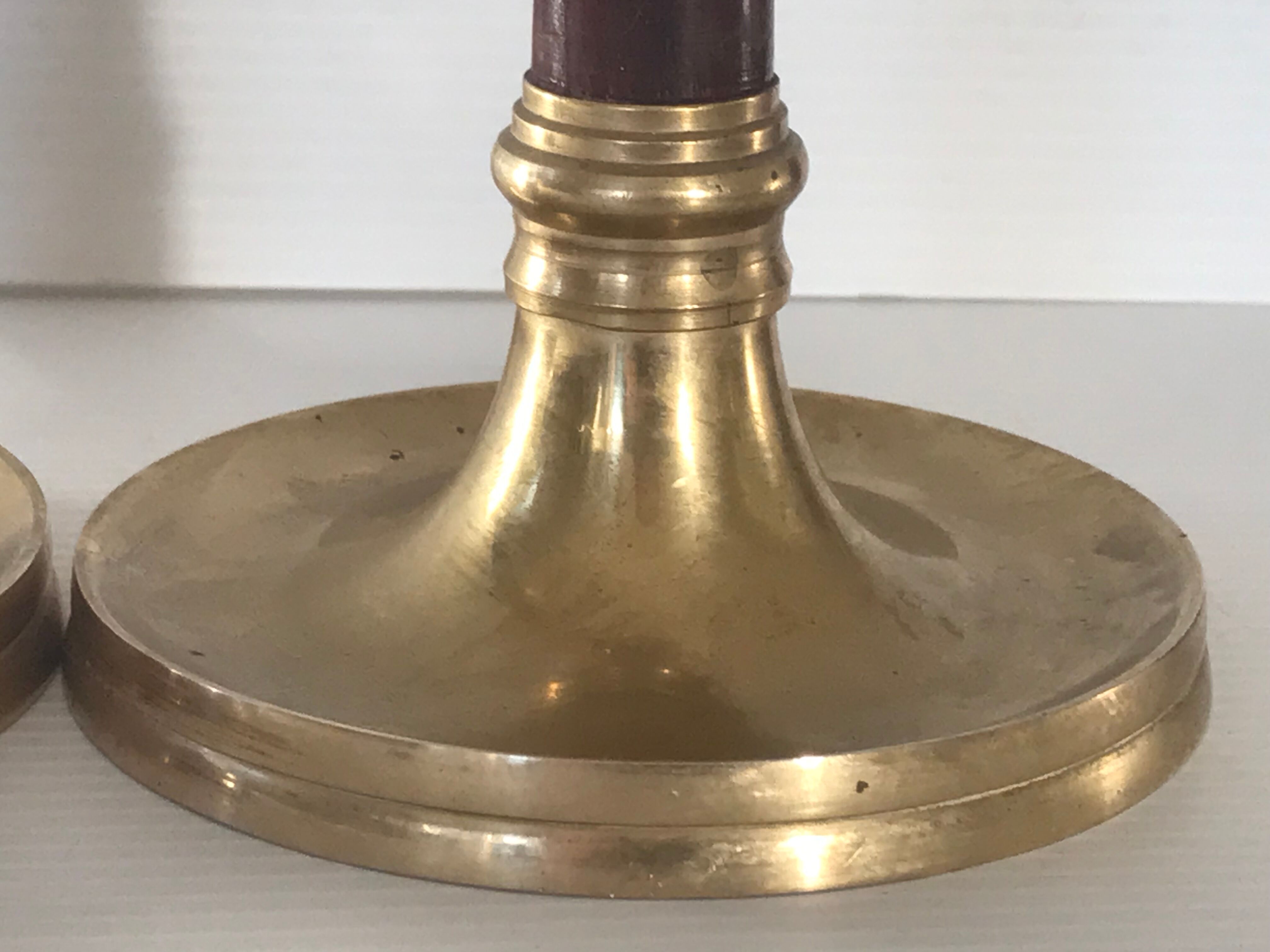 Pair of Scandinavian brass and teak candle holders