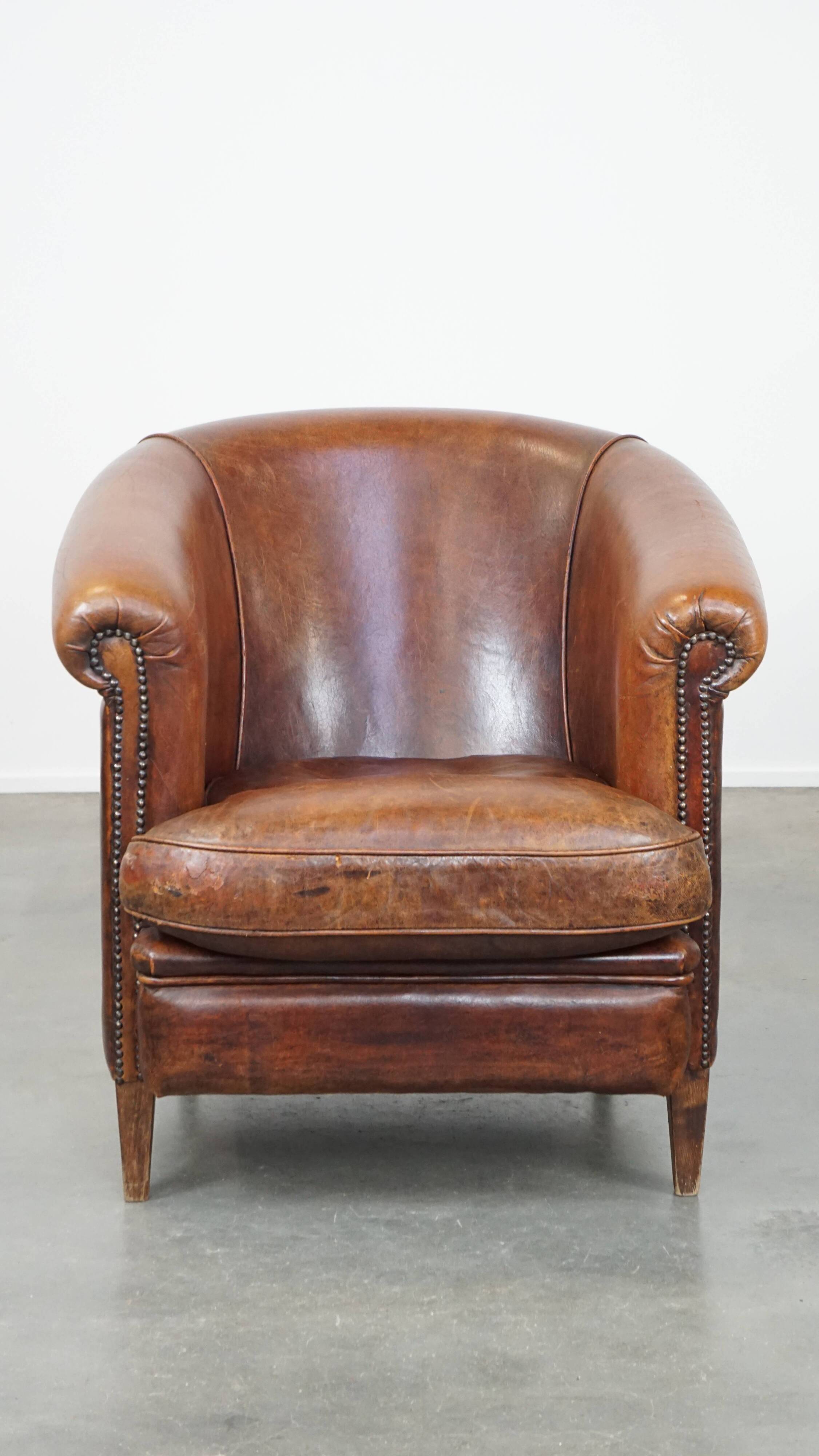 Cognac-colored sheepskin leather club chair