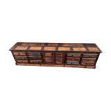 Furniture low in colorful wood. 12 drawers and 1 door