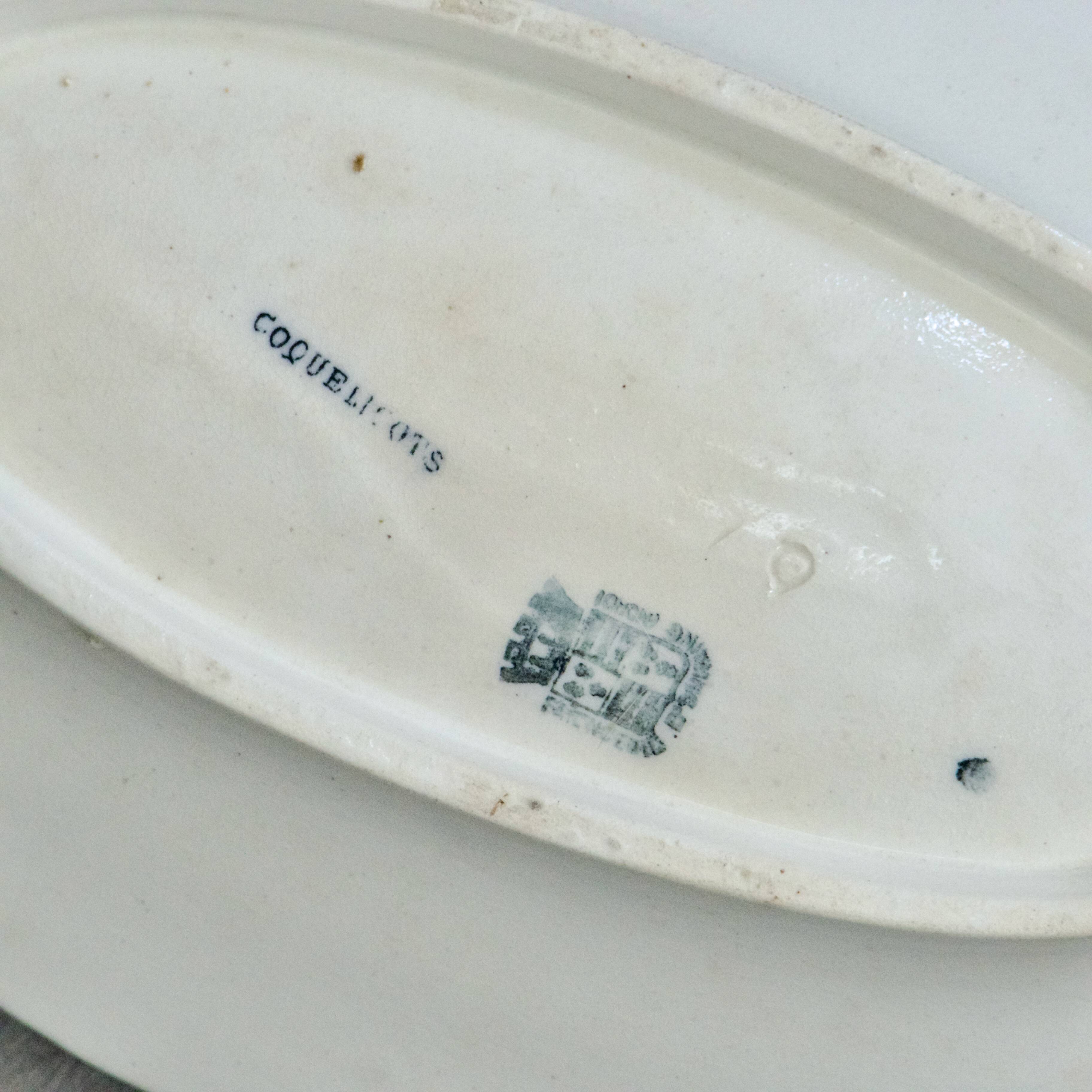 Iron flat plate with a 19th-century bird signed Onnaing "Poppies"