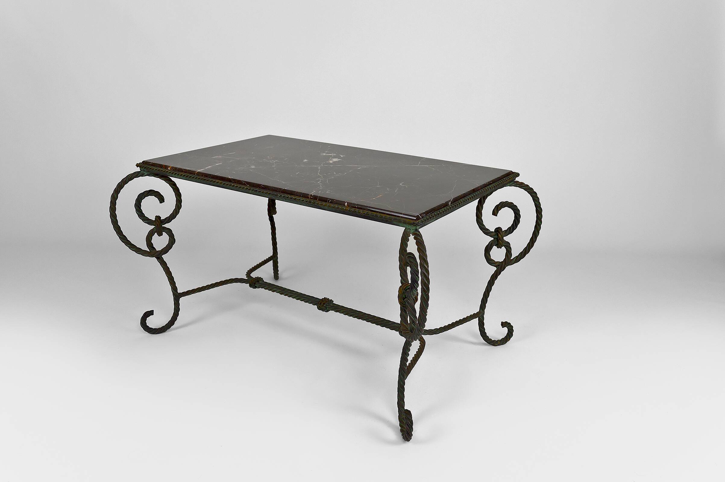Coffee table in patinated wrought iron and black marble, circa 1940