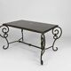 Coffee table in patinated wrought iron and black marble, circa 1940