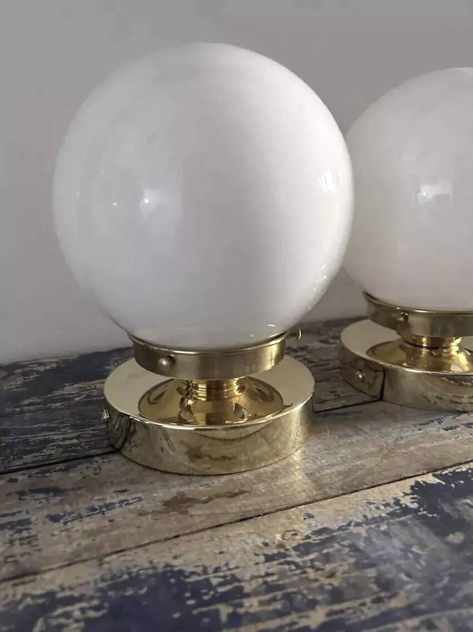 Pair of white opaline globe wall lights