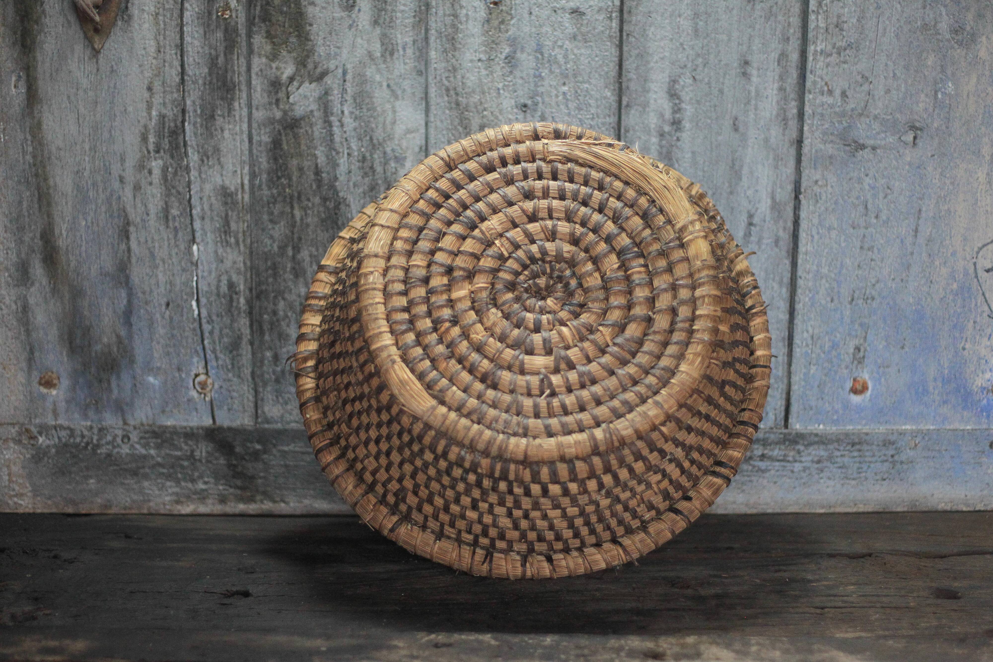 Old wicker basket, straw and bramble, woven basket, countryside.