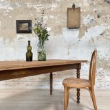 Vintage farmhouse table with turned legs.