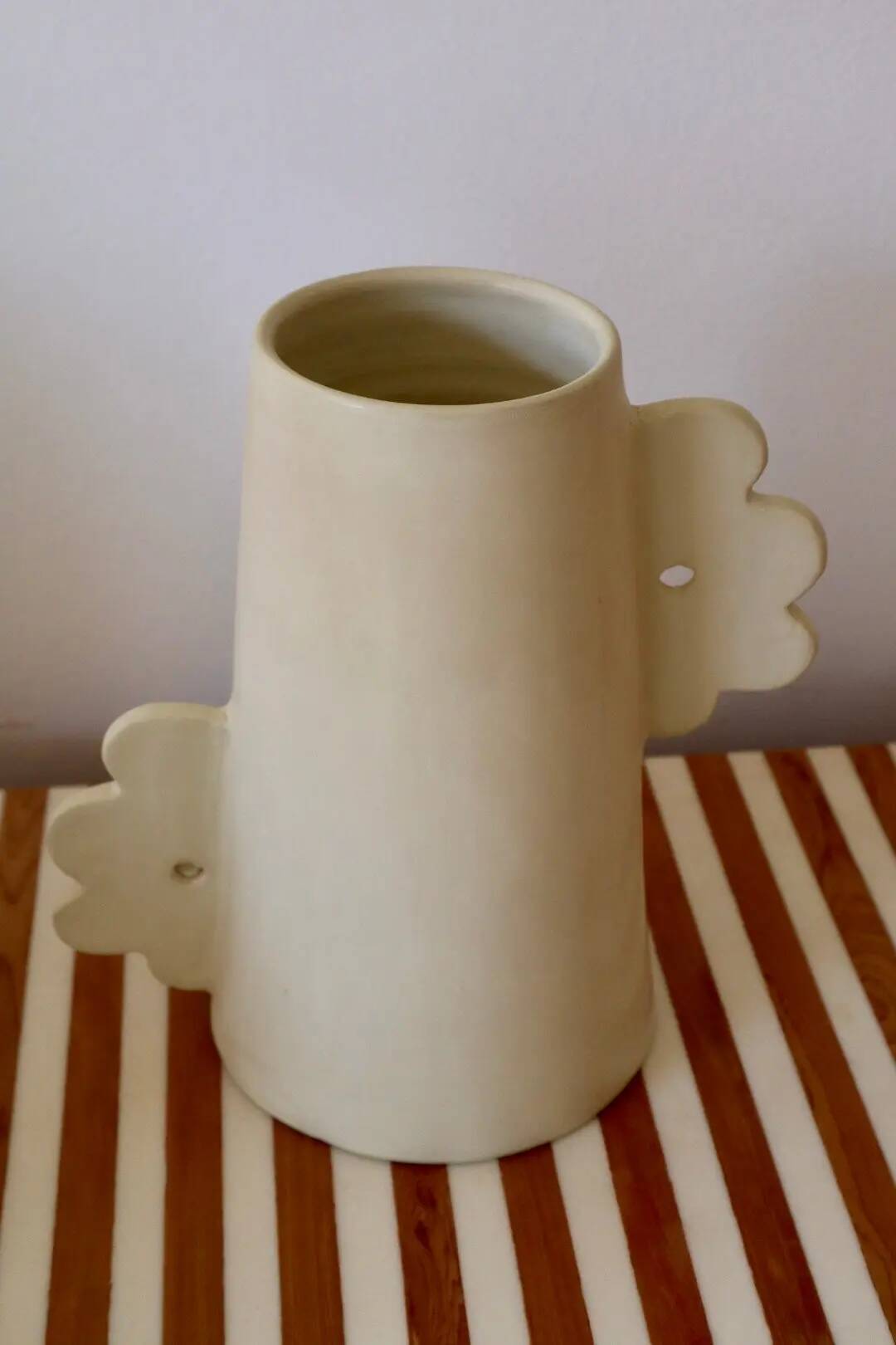 Abstract handmade ceramic vase with off-white matte floral design - daisy
