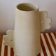 Abstract handmade ceramic vase with off-white matte floral design - daisy