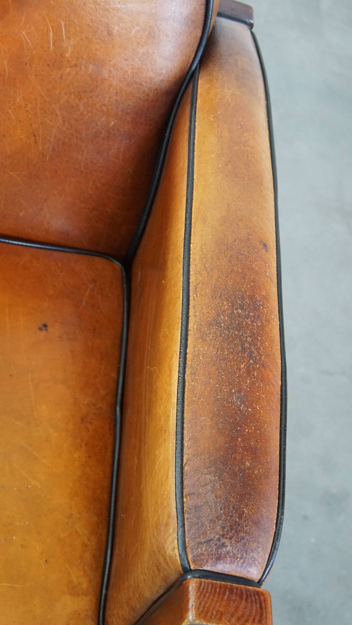 Sheep leather and wooden Art Deco design armchair with ball feet