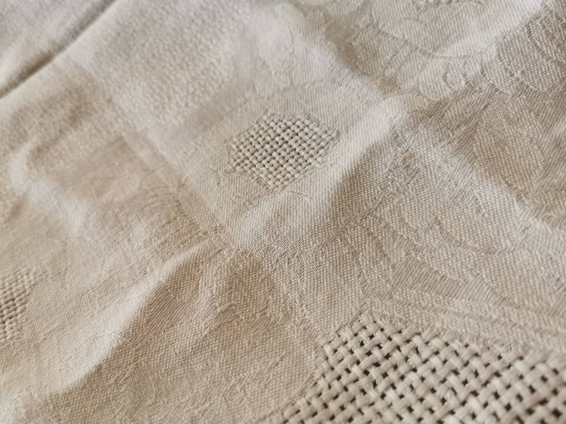 Set of 16 table napkins and an old floral damask tablecloth.