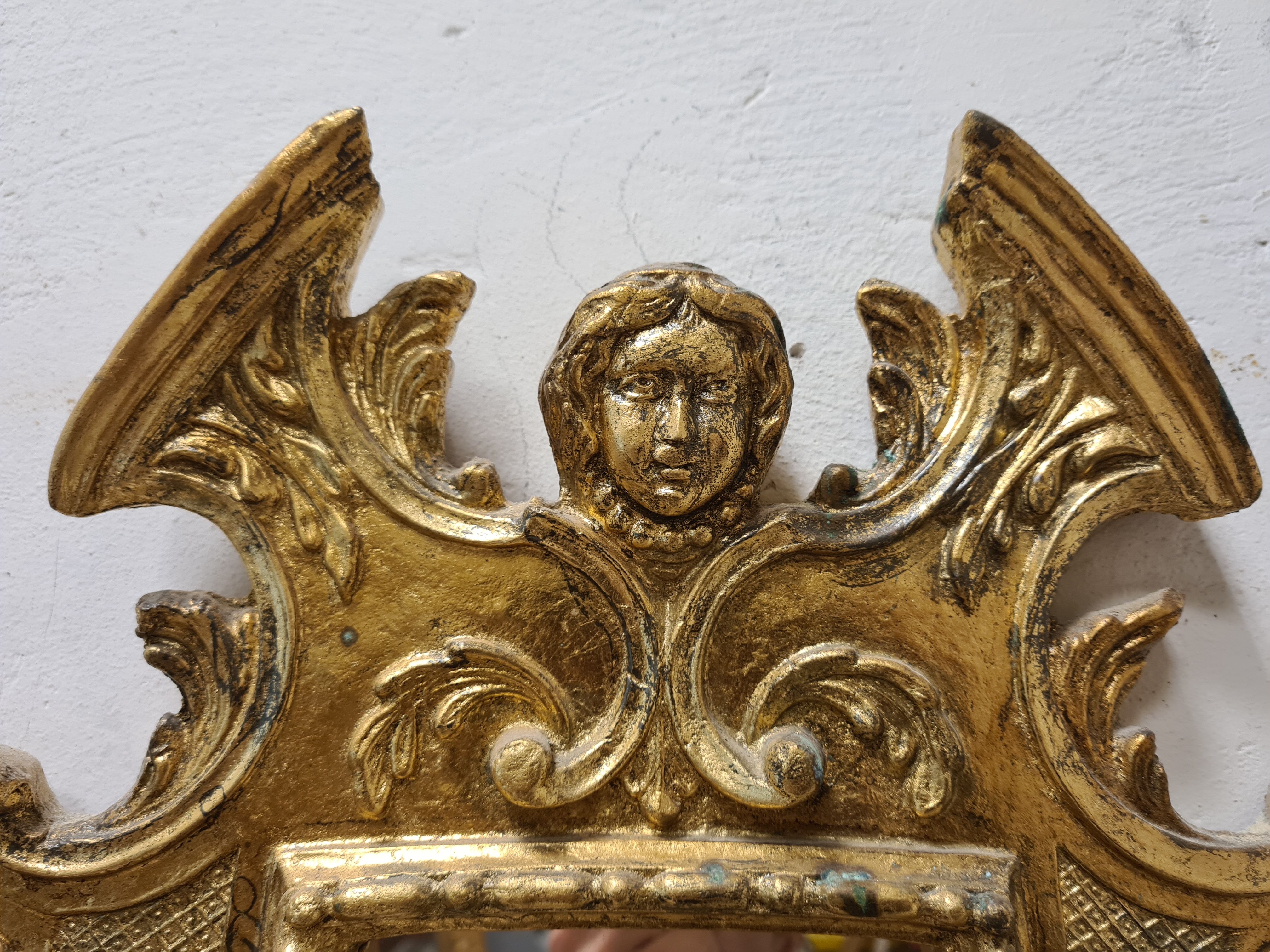 Mirror in gilded plaster with leaf 61x32