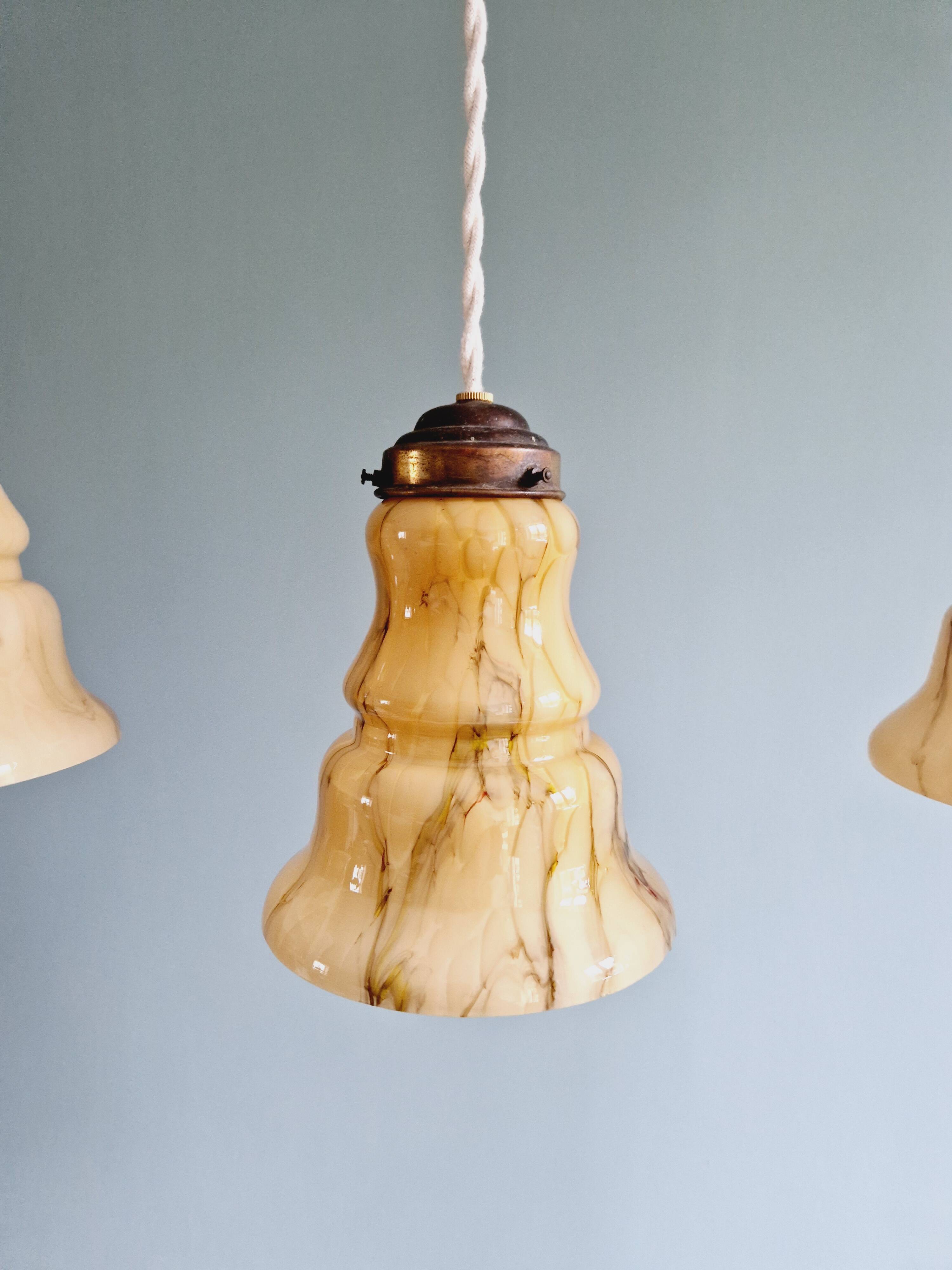 Set of 3 Art Deco marbled opaline pendant lights, 1920s-30s