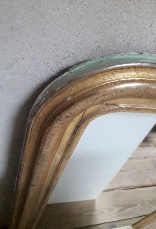 Golden Louis Philippe mirror H122xW84cm with gilded motifs.