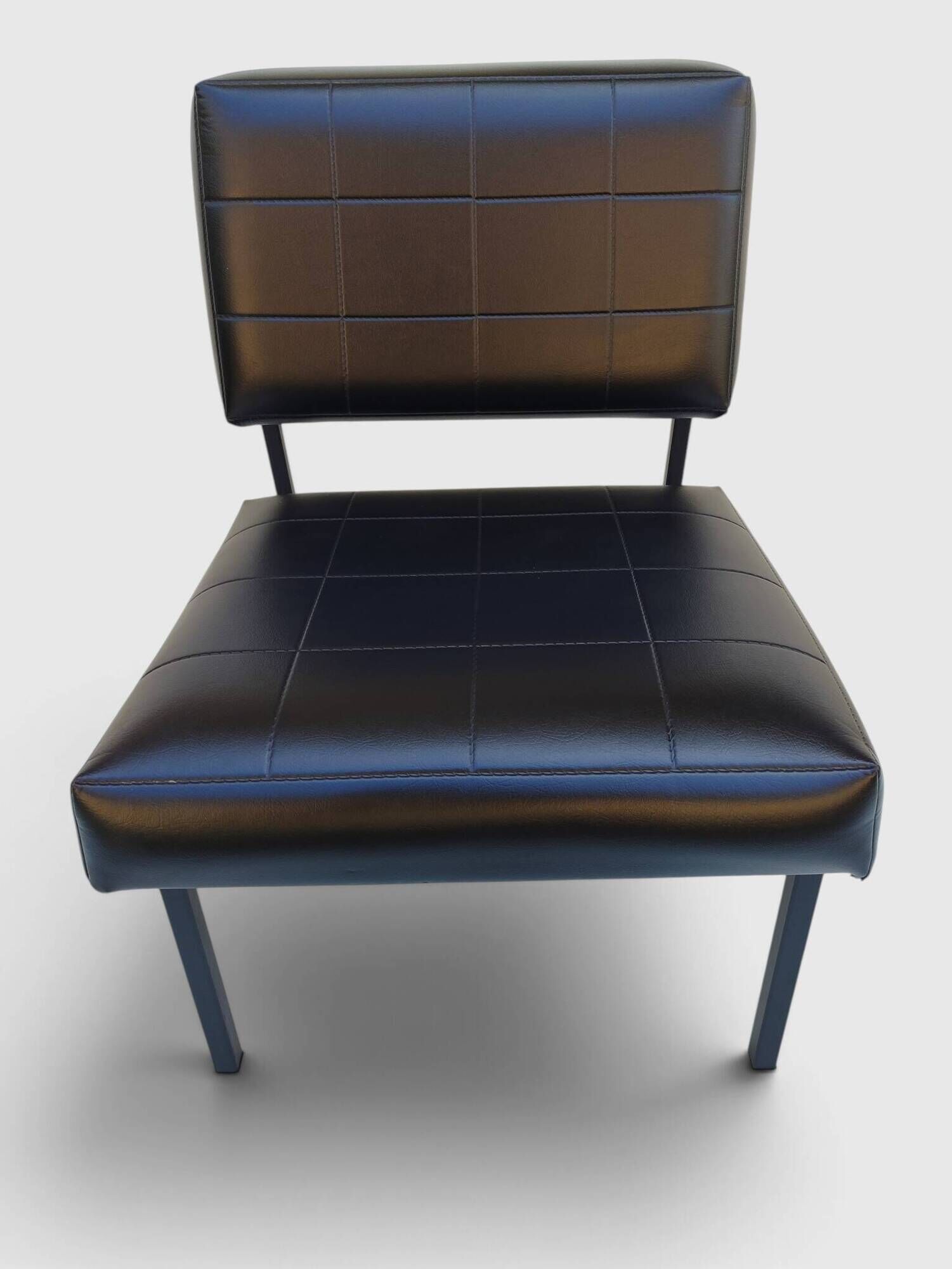 Modernist armchair in black faux leather and metal – 1960s