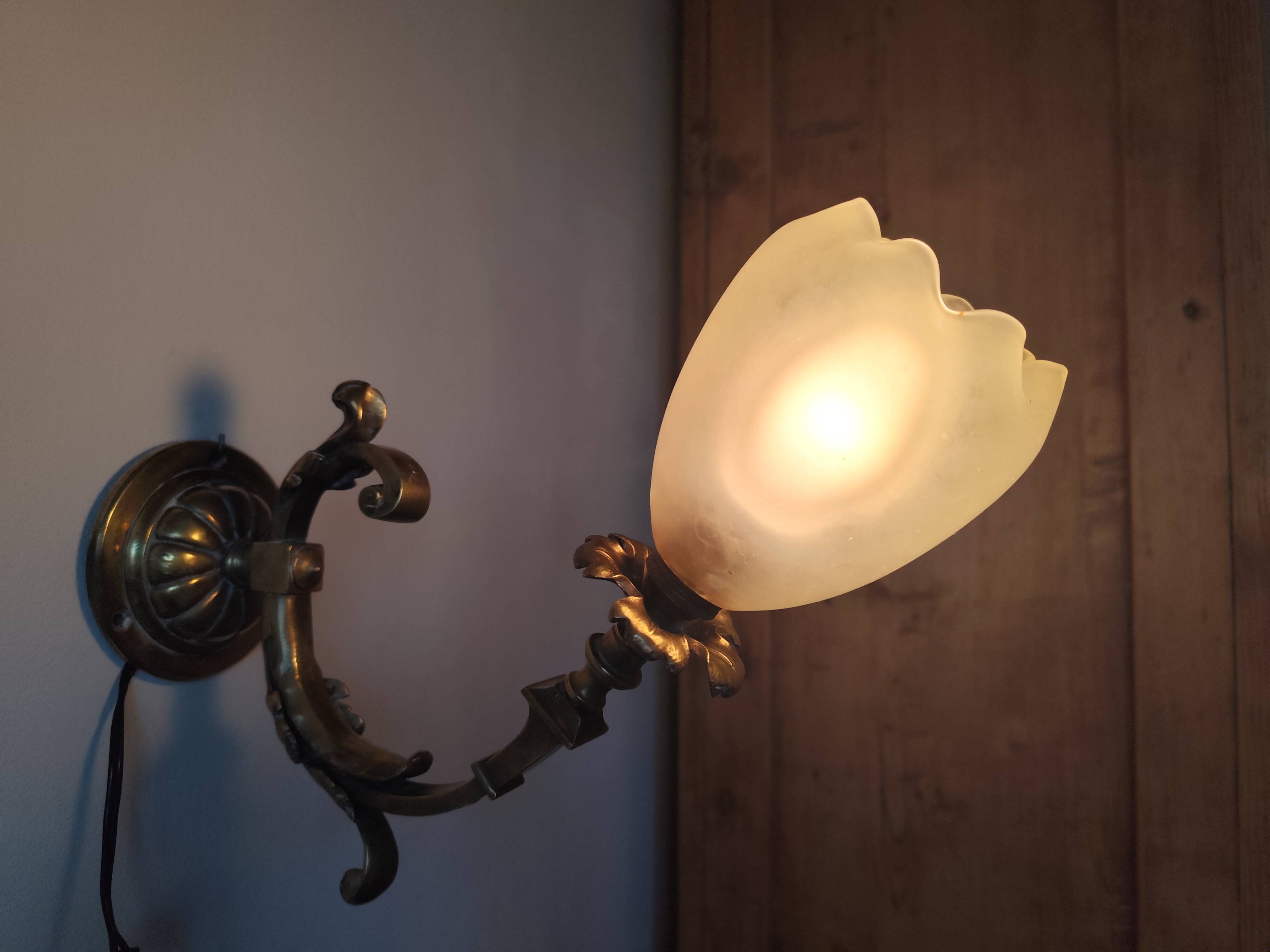 Bronze wall light with opaque glass tulip 1900