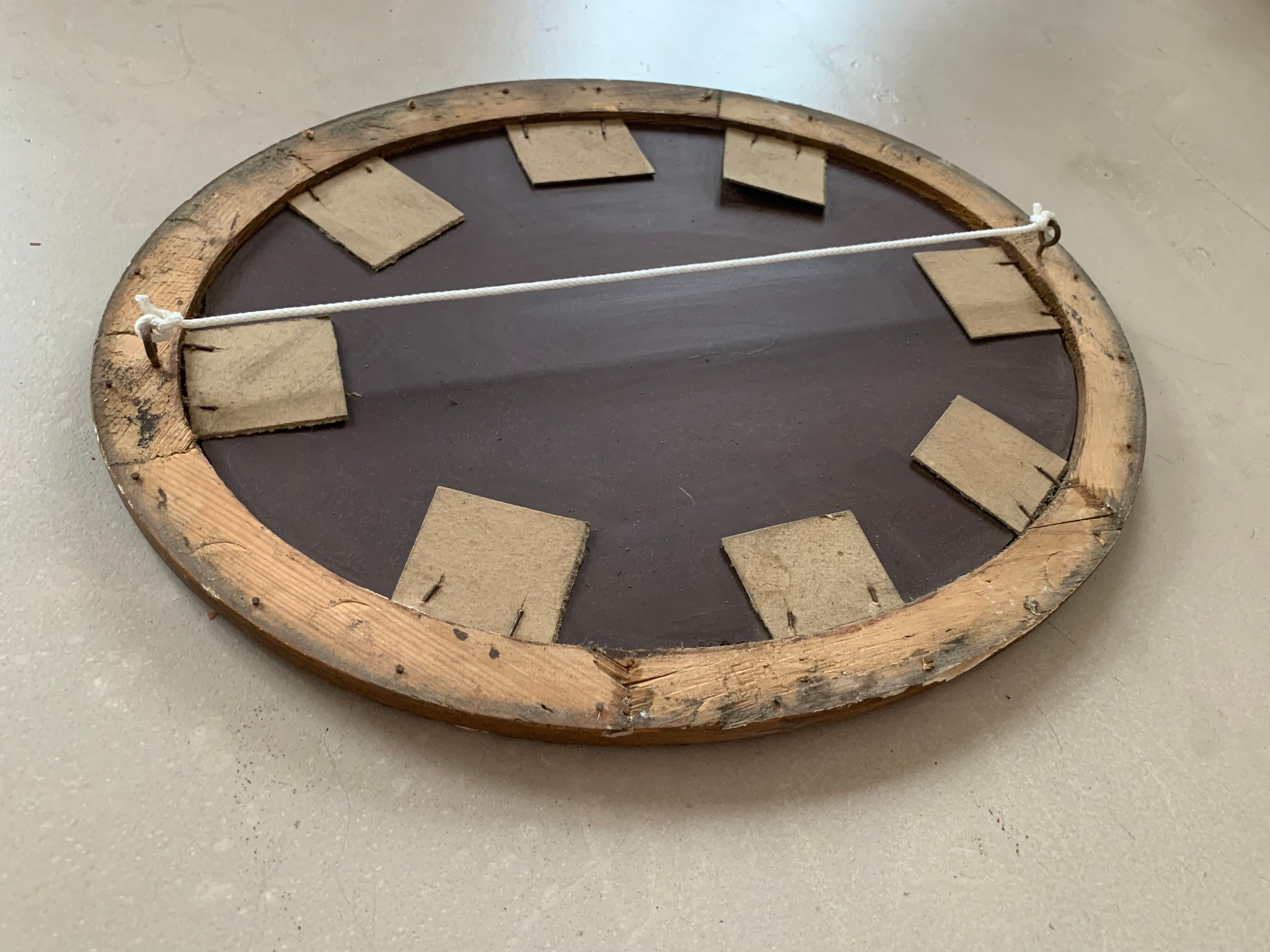 Old oval mirror stitched
