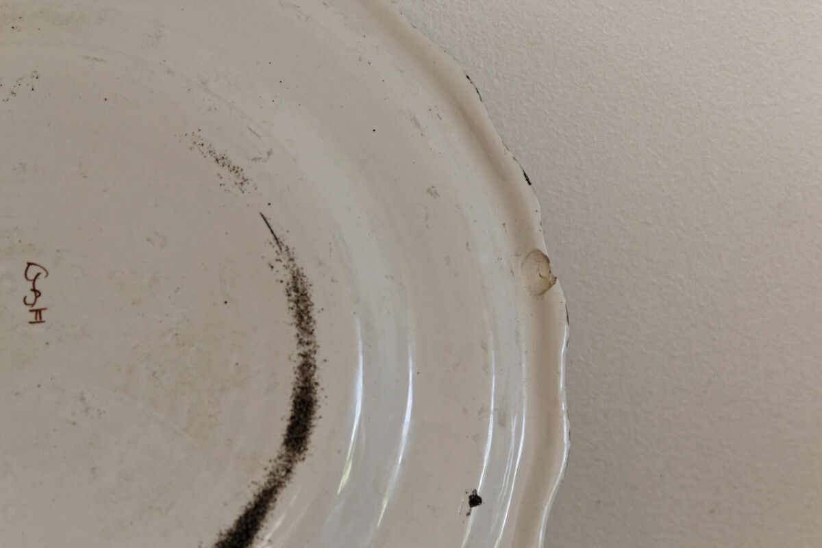 Signed Moustiers plate, in yellow shades