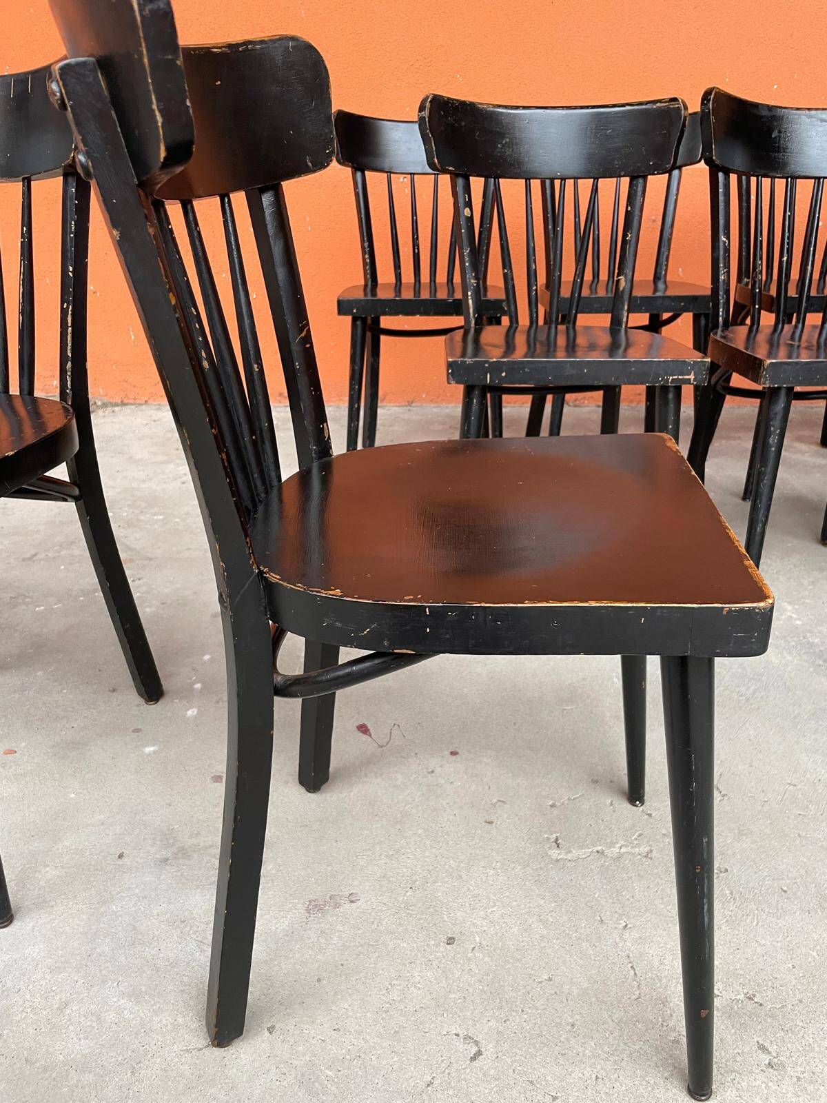 Set of 18 curved wooden bistro chairs with patina from the 60s